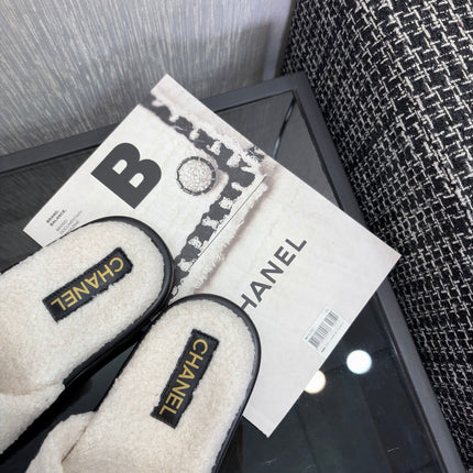 CHANEL 26S SLIDE SANDALS  IN BLACK AND WHITE SHEARLING