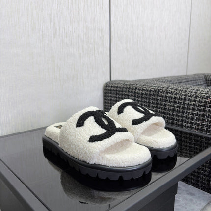 CHANEL 26S SLIDE SANDALS  IN BLACK AND WHITE SHEARLING