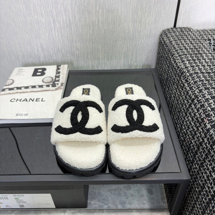 CHANEL 26S SLIDE SANDALS  IN BLACK AND WHITE SHEARLING