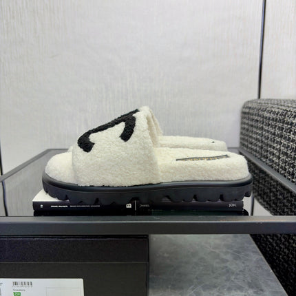 CHANEL 26S SLIDE SANDALS  IN BLACK AND WHITE SHEARLING
