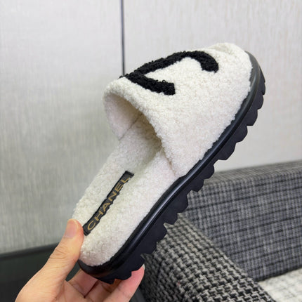 CHANEL 26S SLIDE SANDALS  IN BLACK AND WHITE SHEARLING