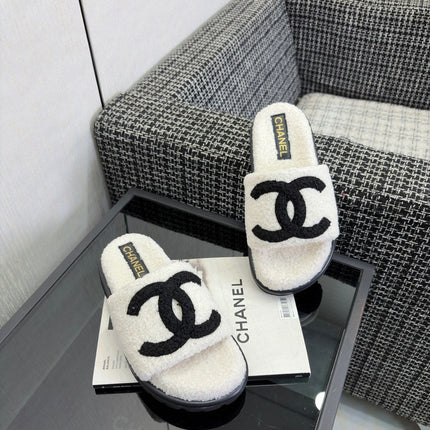 CHANEL 26S SLIDE SANDALS  IN BLACK AND WHITE SHEARLING
