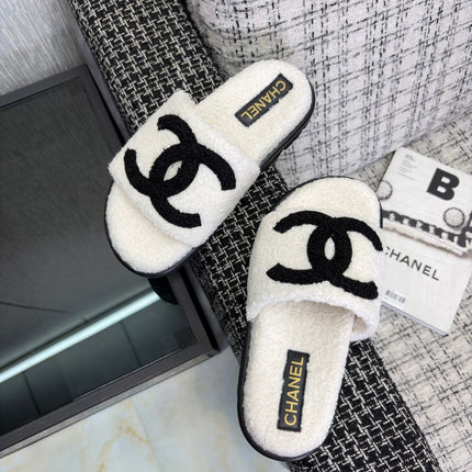 CHANEL 26S SLIDE SANDALS  IN BLACK AND WHITE SHEARLING