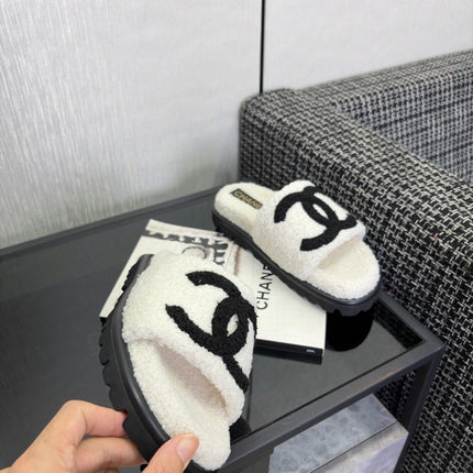 CHANEL 26S SLIDE SANDALS  IN BLACK AND WHITE SHEARLING