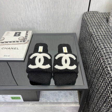 CHANEL 26S SLIDE SANDALS IN BLACK SHEARLING AND WHITE CC LOGO SQUARE TOE
