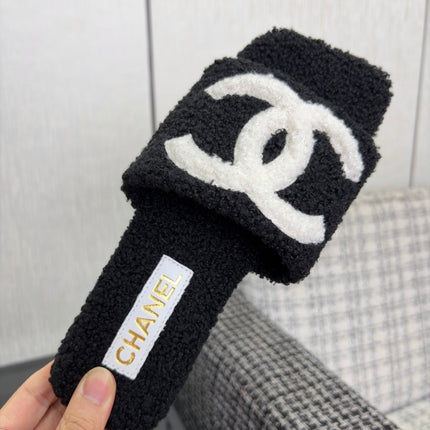 CHANEL 26S SLIDE SANDALS IN BLACK SHEARLING AND WHITE CC LOGO SQUARE TOE