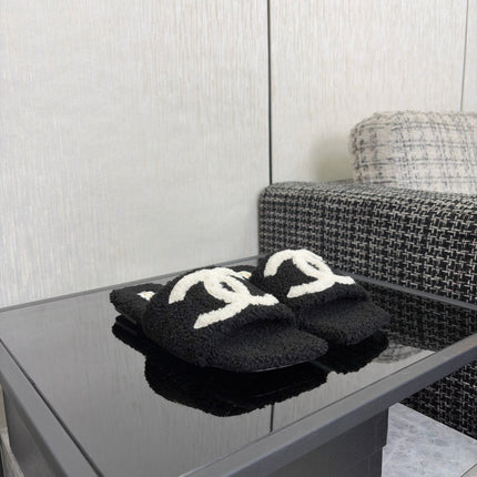 CHANEL 26S SLIDE SANDALS IN BLACK SHEARLING AND WHITE CC LOGO SQUARE TOE