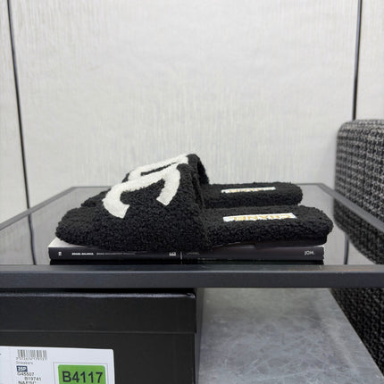 CHANEL 26S SLIDE SANDALS IN BLACK SHEARLING AND WHITE CC LOGO SQUARE TOE
