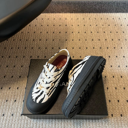 CHANEL 26S LACE UP SNEAKERS IN BLACK CALFSKIN AND WHITE PONY HAIR