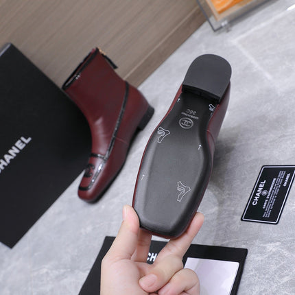 CHANEL 26S ANKLE BOOTS IN BURGUNDY CALFSKIN WITH BLACK PATENT LEATHER TRIM AND CC LOGO ON TOE CAP