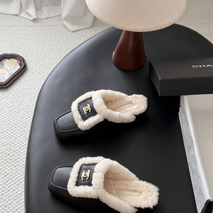 CHANEL 26S MULES IN BLACK SHEARLING AND CALFSKIN