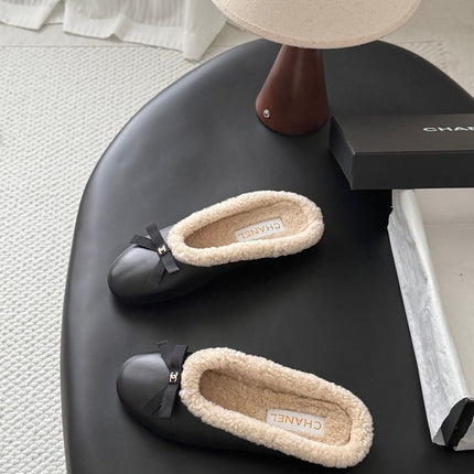 CHANEL 26S MULES IN BLACK LAMBSKIN AND SHEARLING