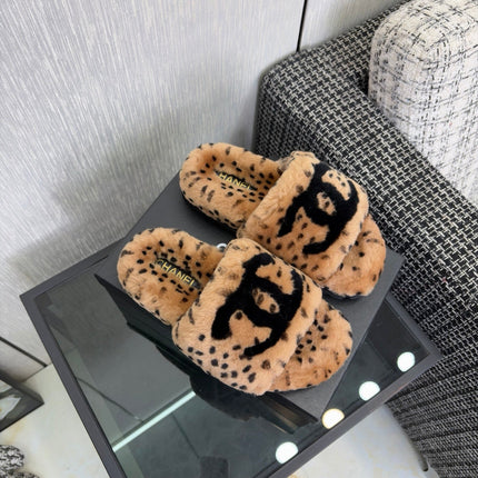 CHANEL 26S PLATFORM SLIDE SANDALS IN CAMEL AND BLACK SHEARLING DALMATIAN PRINT